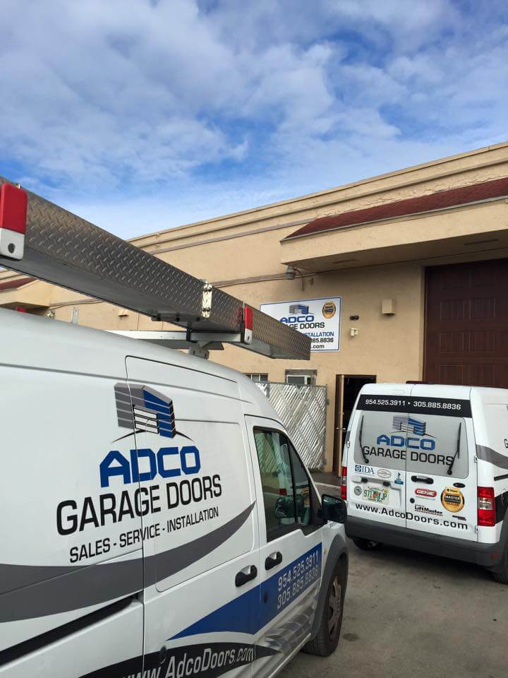 ADCO commercial garage door service vans.